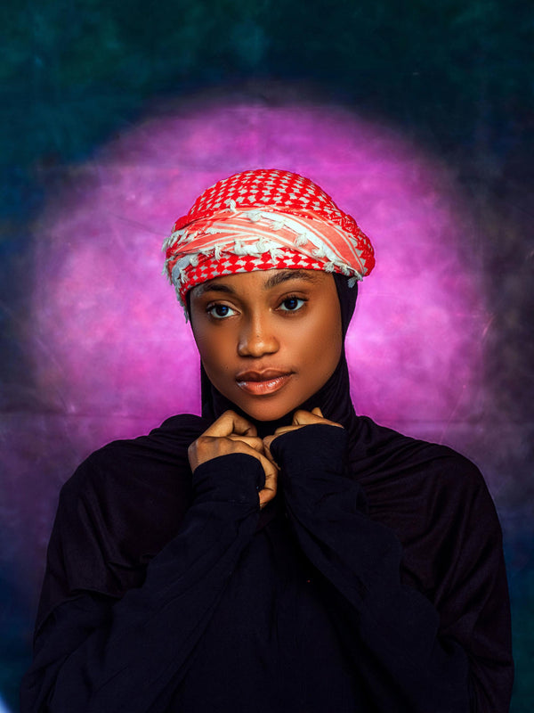 Woman wearing traditional keffiyeh pattern hijab, editorial portrait
